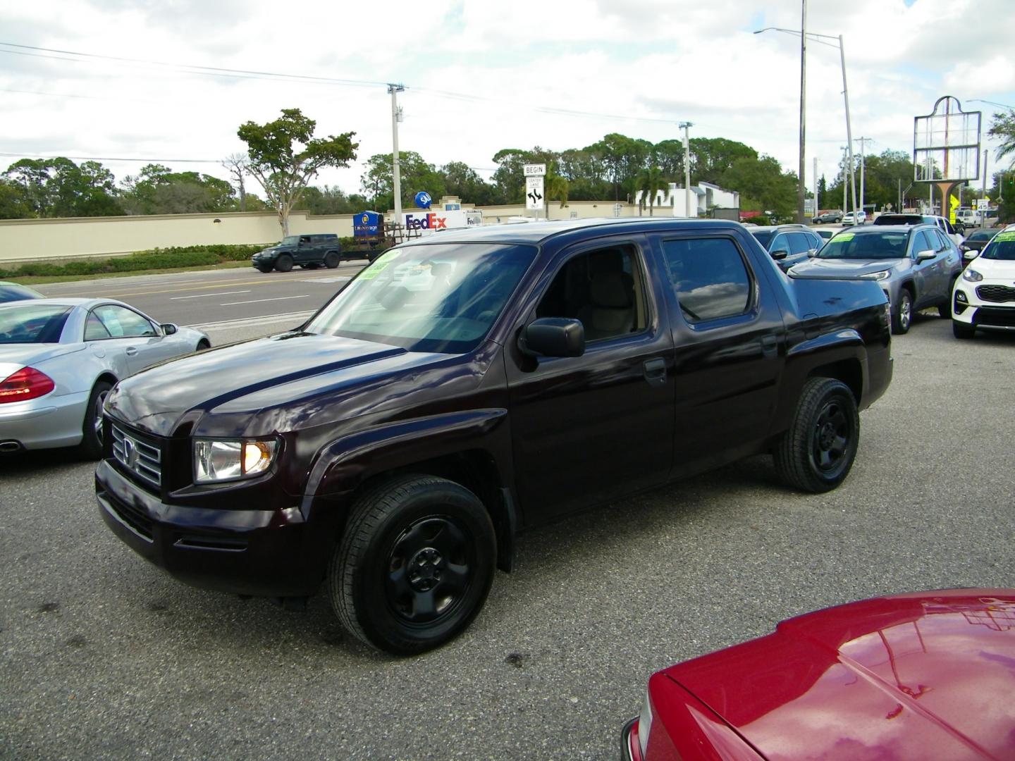 2007 Maroon /Grey Honda Ridgeline RT (2HJYK16267H) with an 3.5L V6 SOHC 24V engine, 5-Speed Automatic Overdrive transmission, located at 4000 Bee Ridge Road, Sarasota, FL, 34233, (941) 926-0300, 27.298664, -82.489151 - Photo#0